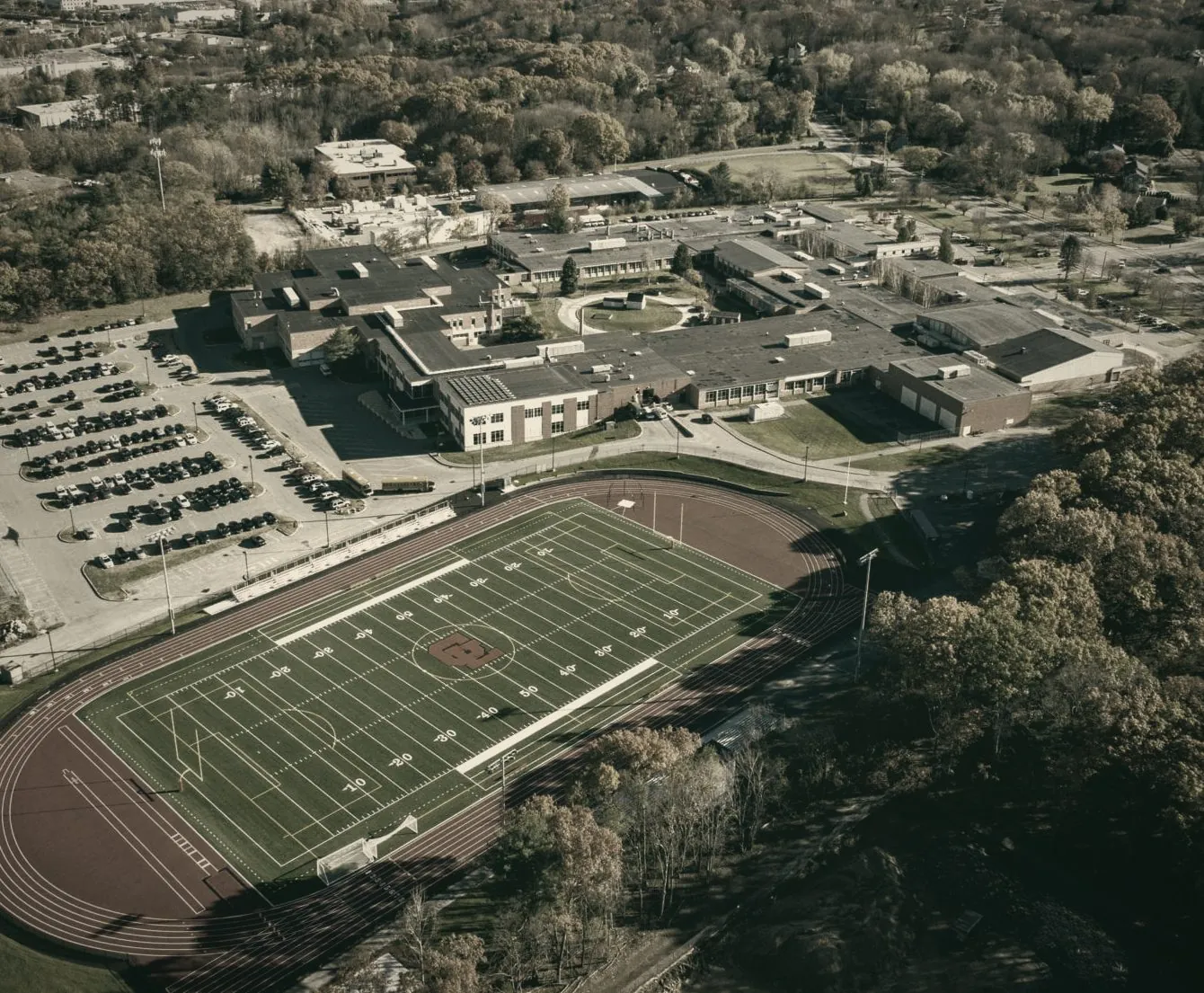 Aerial view of Greater Lawrence Technical School campus, track, and football field